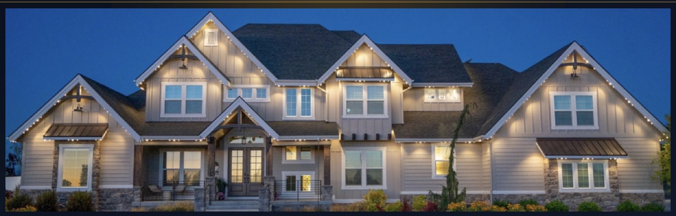 Large home with warm-white permanent lighting along every roofline at dusk